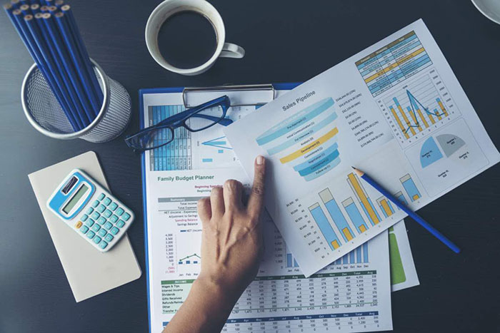 Excel Spreadsheet stats graph analytics data. Accountant hands holding Financial Document Trading Information with excel file. Finance statistic report analyze business graph, chart,database,report.